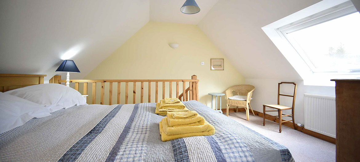 Our self catering accommodation in Glenhinnisdal contains a comfortable double bed offering mountain views of the Isle of Skye