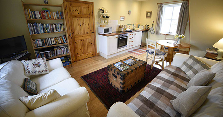 Contact Half of Three self catering accommodation with comfortable seating area and modern kitchen